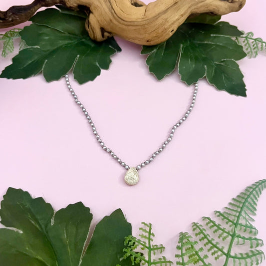 Handmade Necklace with grey pearl, fossilized coral briolette knotted on grey silk